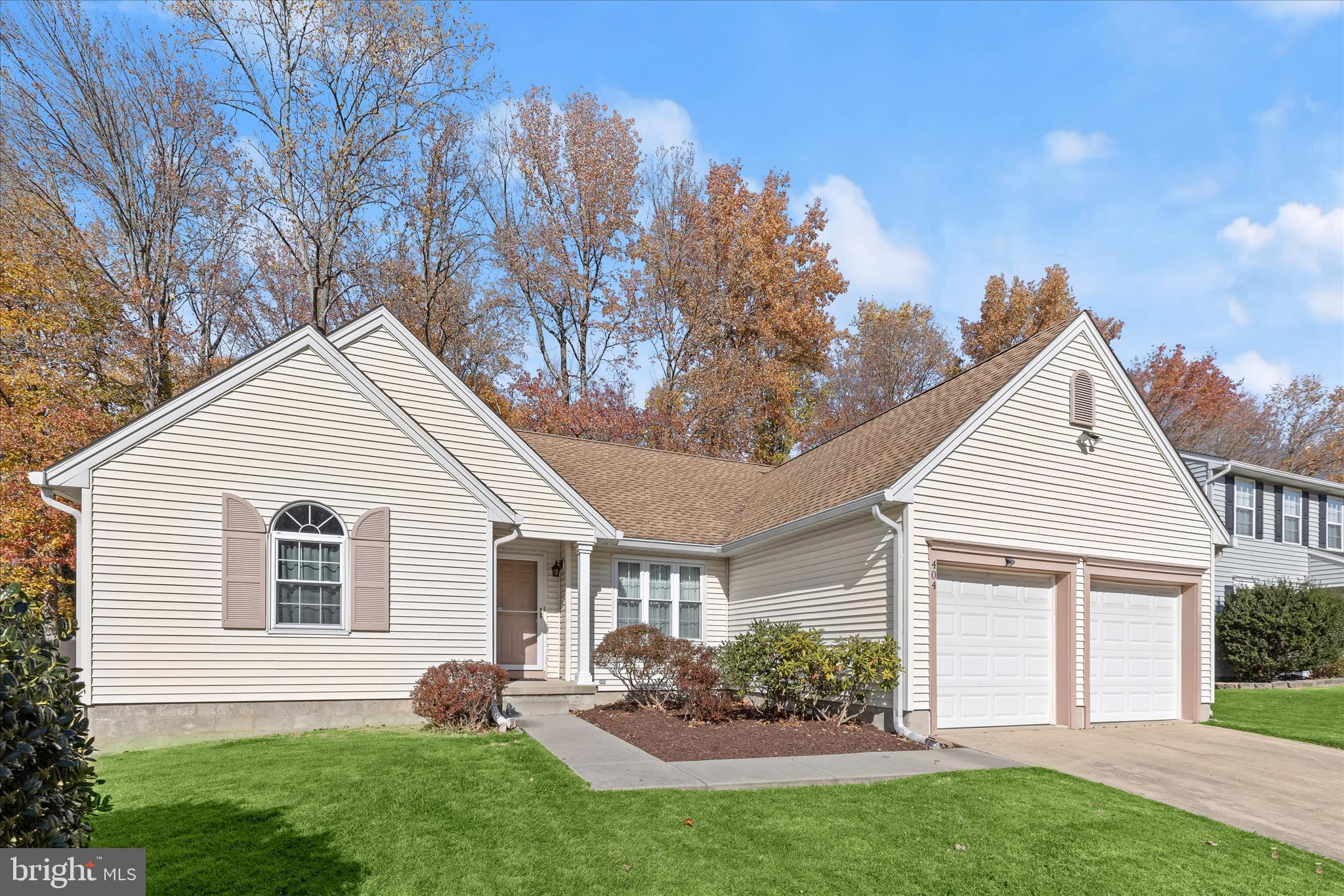 404 Arrow Wood Court Abingdon, MD 21009 - Photo 7 of 24 a view of a house with a yard and a garden