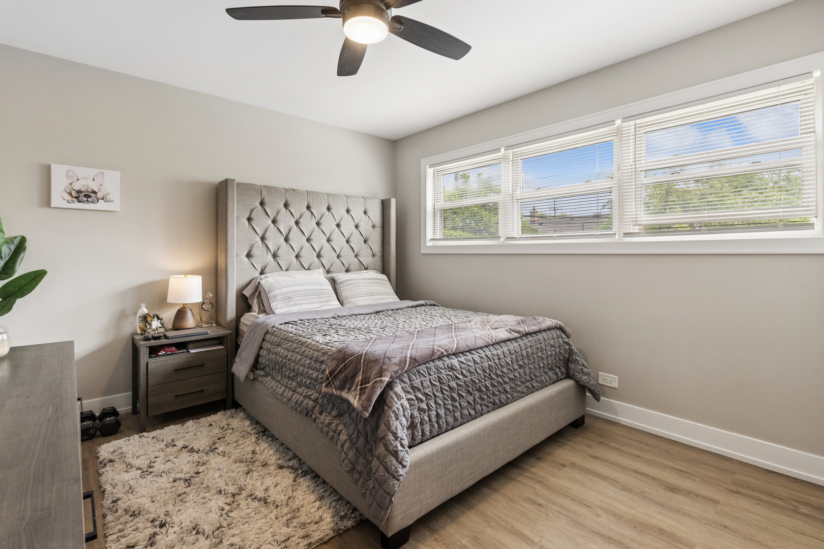 7911 West Rascher Avenue Chicago, IL 60656 - Photo 22 of 39 a bedroom with a bed and wooden floor