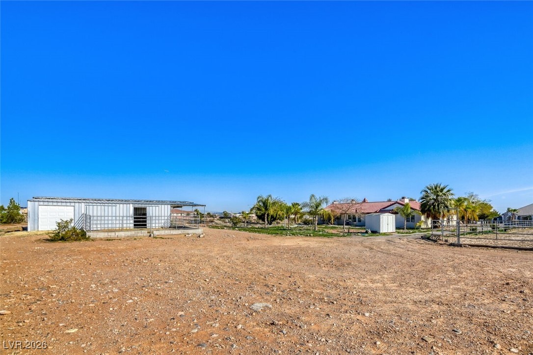 8565 South Westwind Road Las Vegas, NV 89139 - Photo 47 of 53 Backyard, stable, and back of structure
