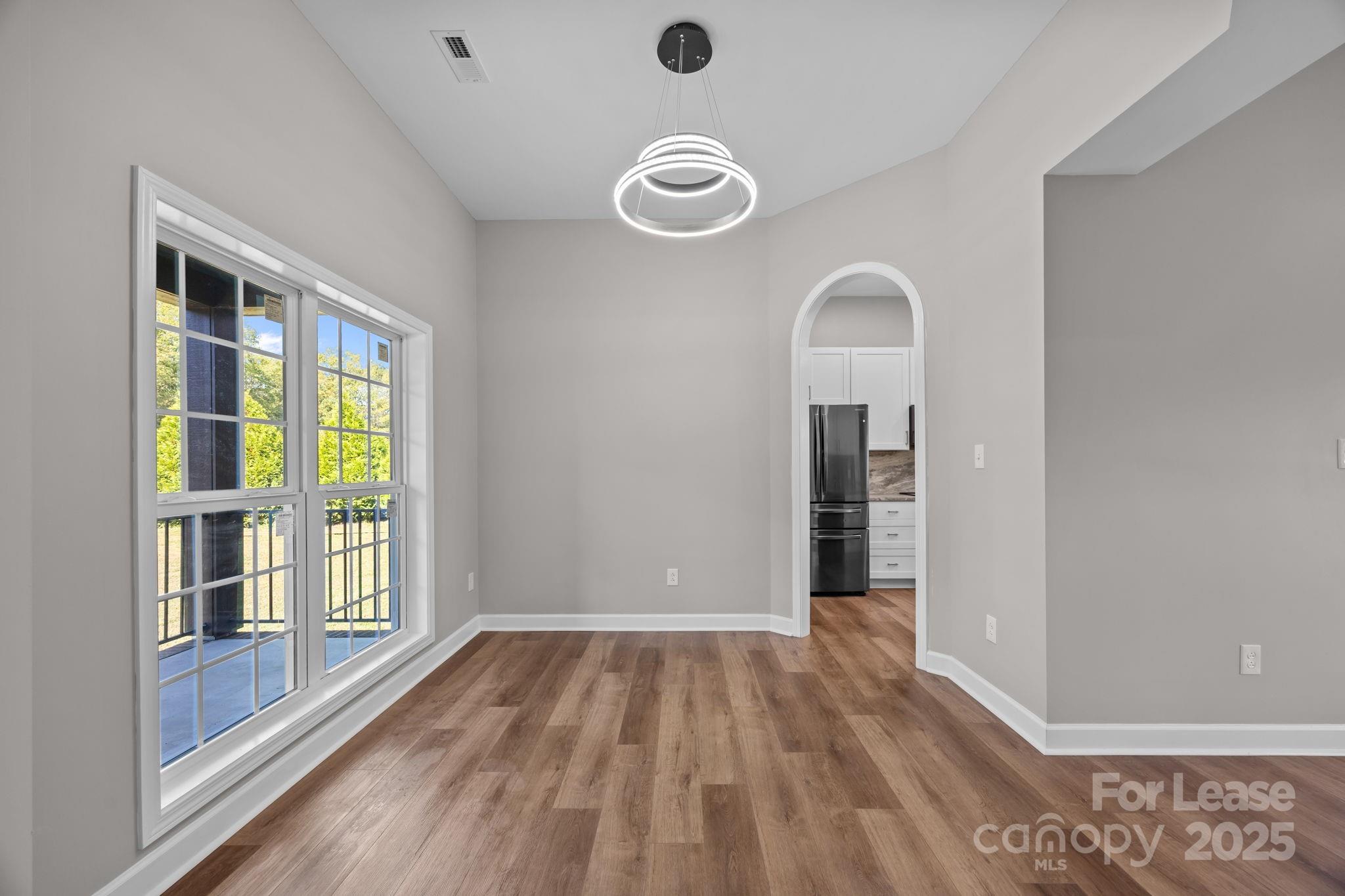 4855 New Cut Road Inman, SC 29349 - Photo 12 of 40 a view of a livingroom with wooden floor and a large window