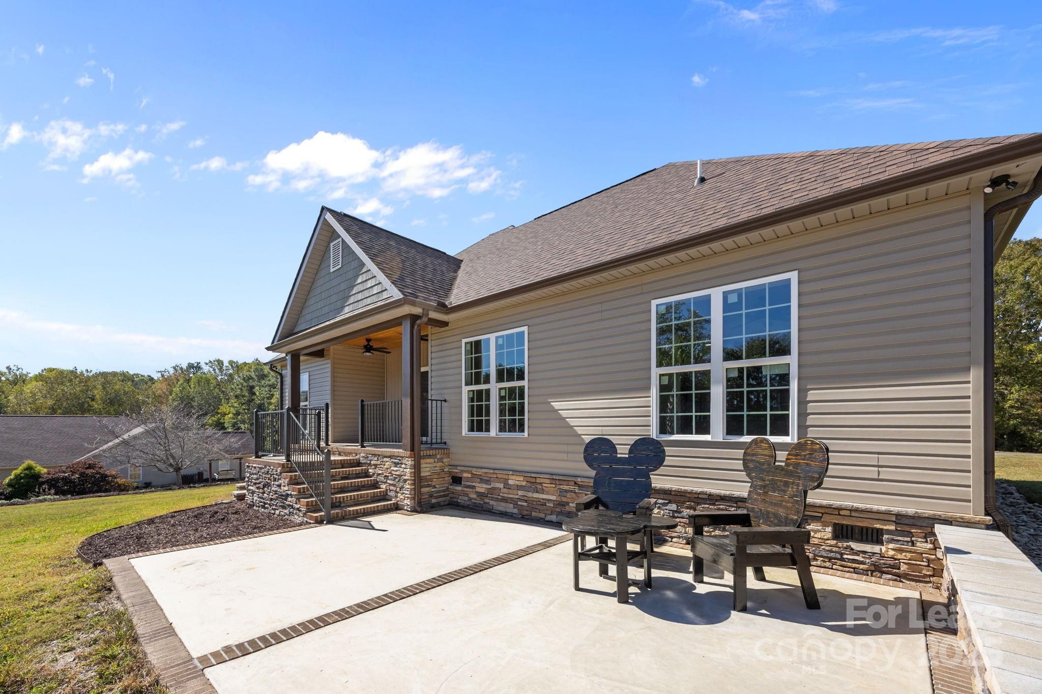 4855 New Cut Road Inman, SC 29349 - Photo 5 of 40 a view of a house with patio and a yard