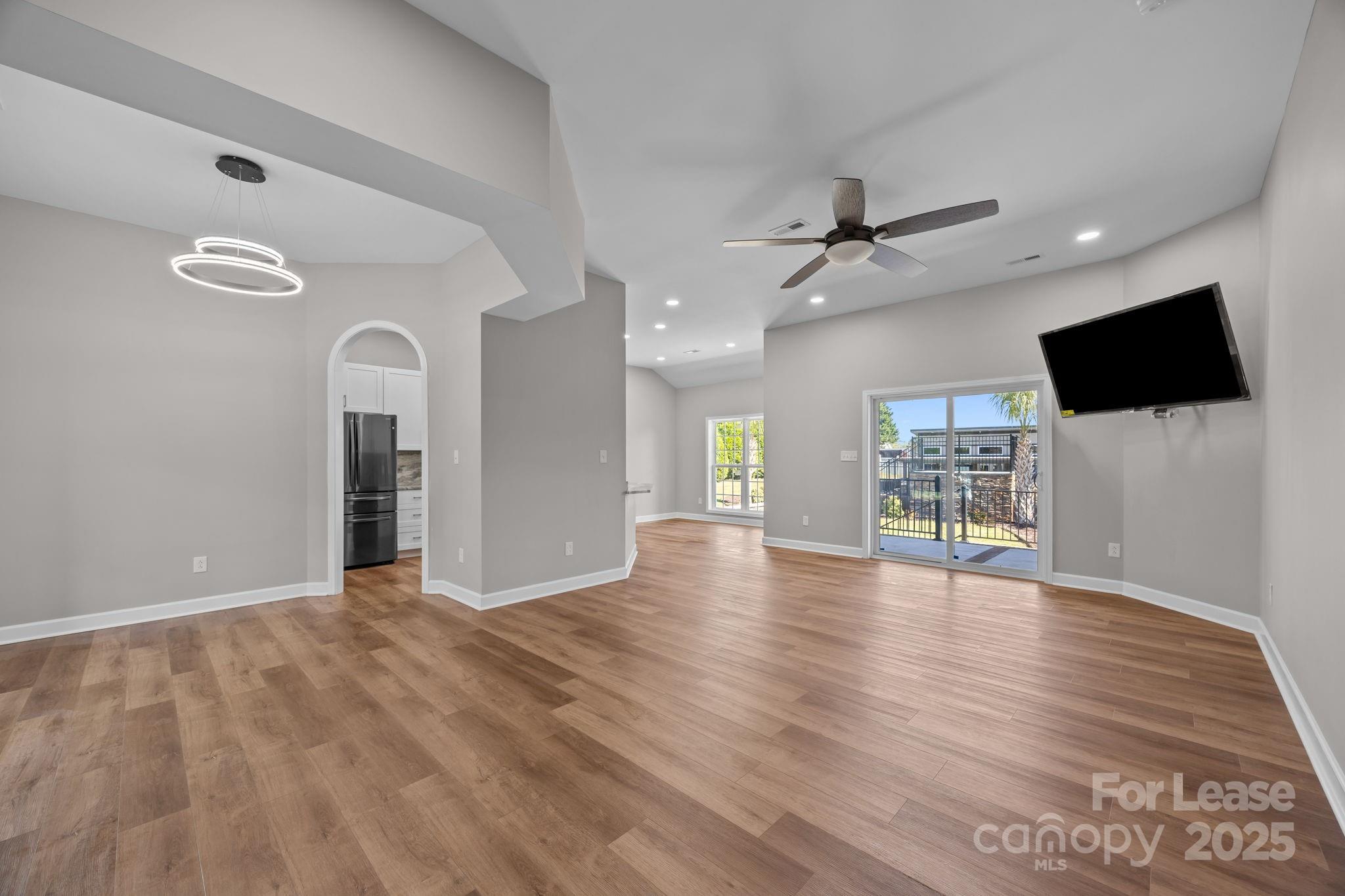 4855 New Cut Road Inman, SC 29349 - Photo 8 of 40 a view of an empty room with a window and wooden floor