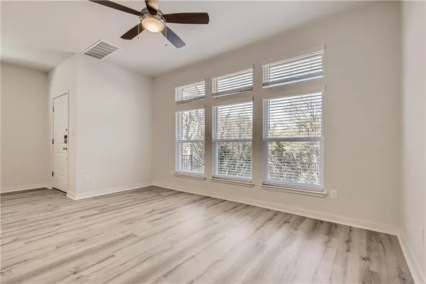 a kitchen with granite countertop a sink stove and refrigerator