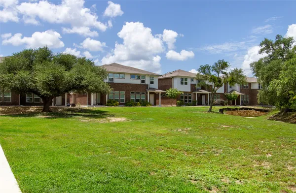 a view of a house with a big yard