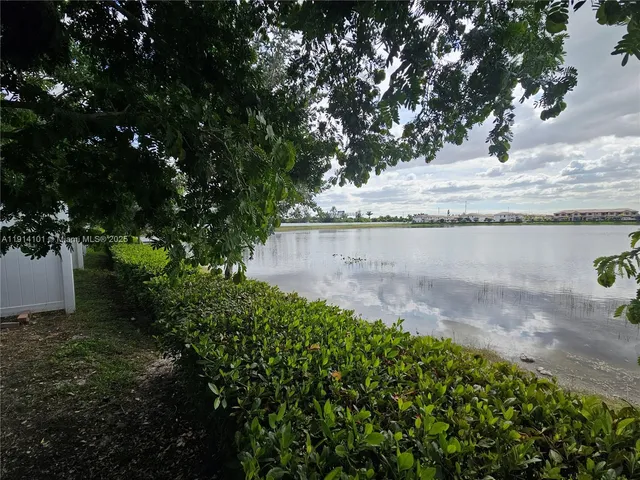 a view of a backyard with sitting area