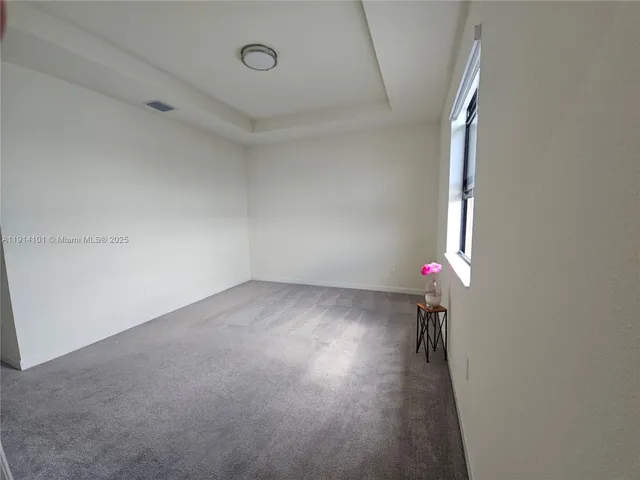 a view of storage and utility room with racks on the wall