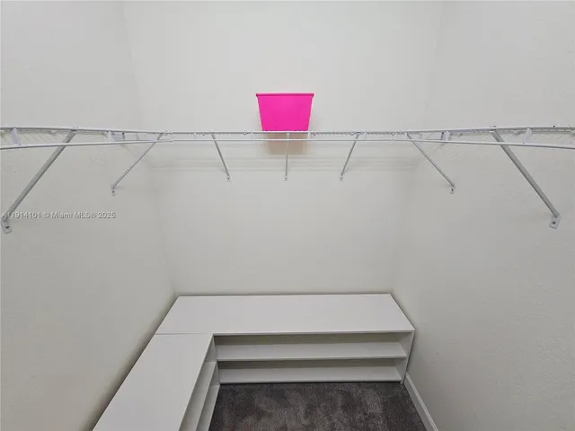 a bathroom with a sink toilet and mirror