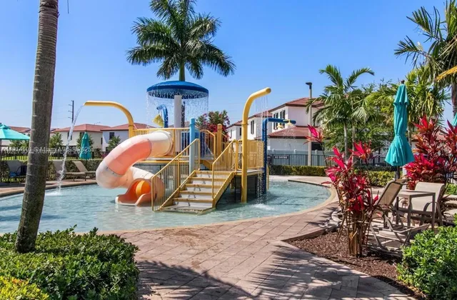 a view of a park with swings and slides