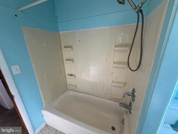 a bathroom with a bath tub