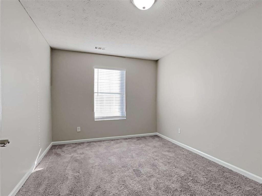 4856 Haymarket Trail Decatur, GA 30035 - Photo 15 of 23 an empty room with a window