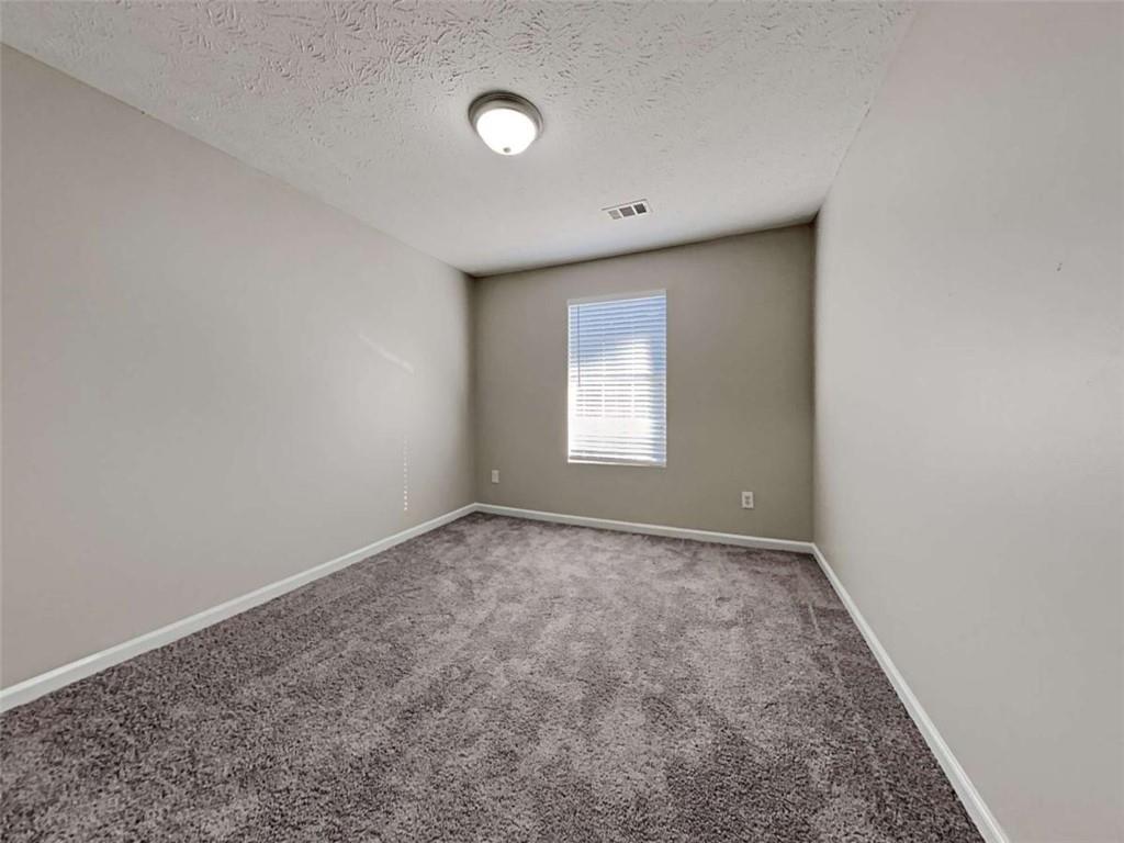 4856 Haymarket Trail Decatur, GA 30035 - Photo 17 of 23 an empty room with a window