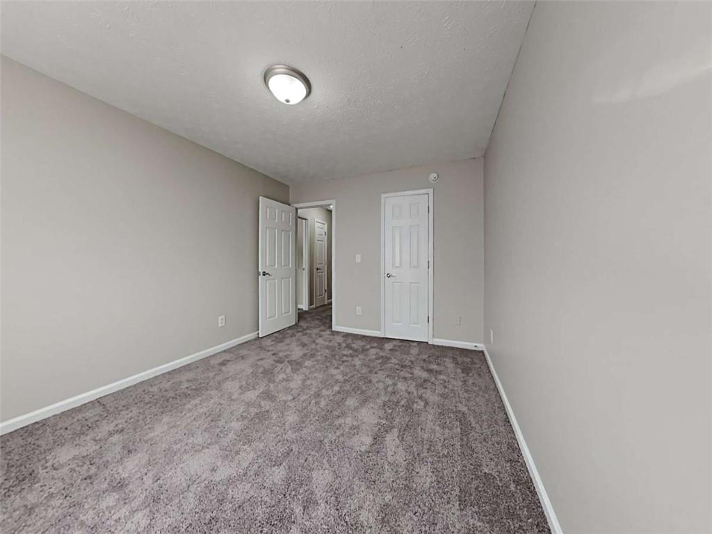4856 Haymarket Trail Decatur, GA 30035 - Photo 18 of 23 a view of an empty room and window