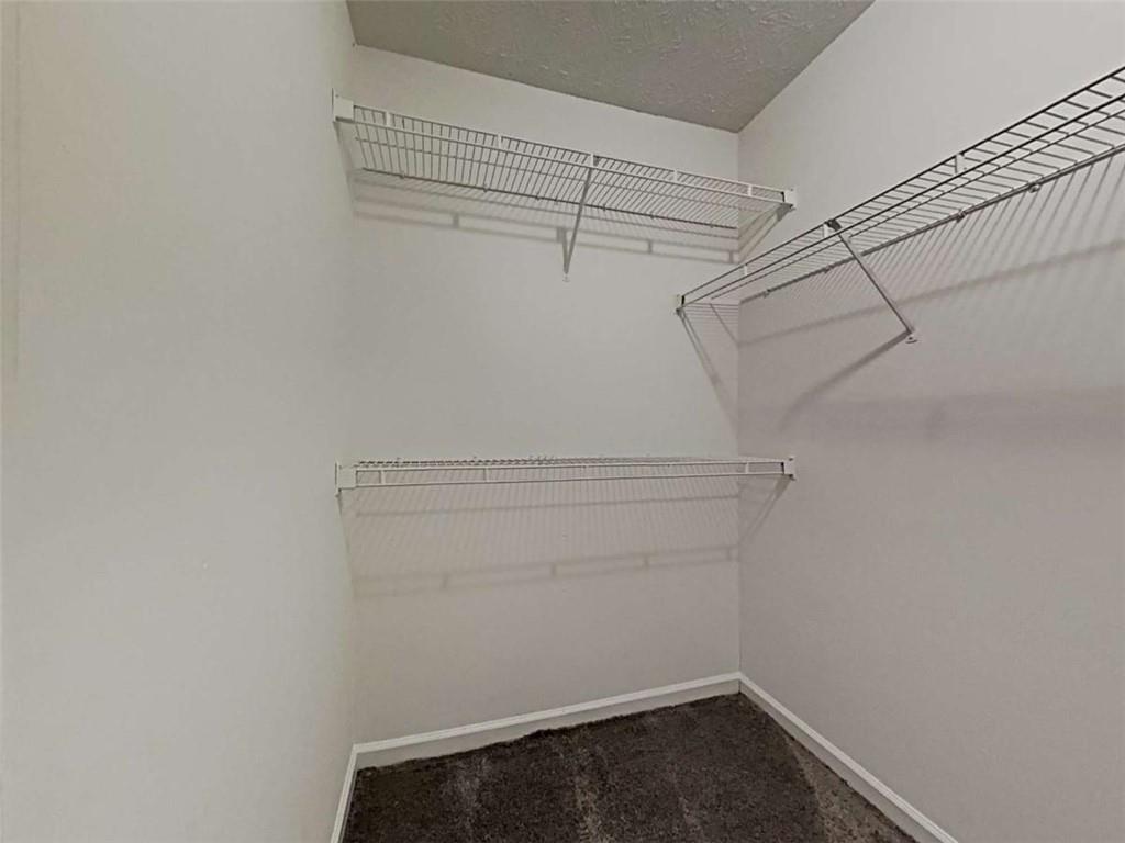 4856 Haymarket Trail Decatur, GA 30035 - Photo 20 of 23 a view of a room with racks on the wall