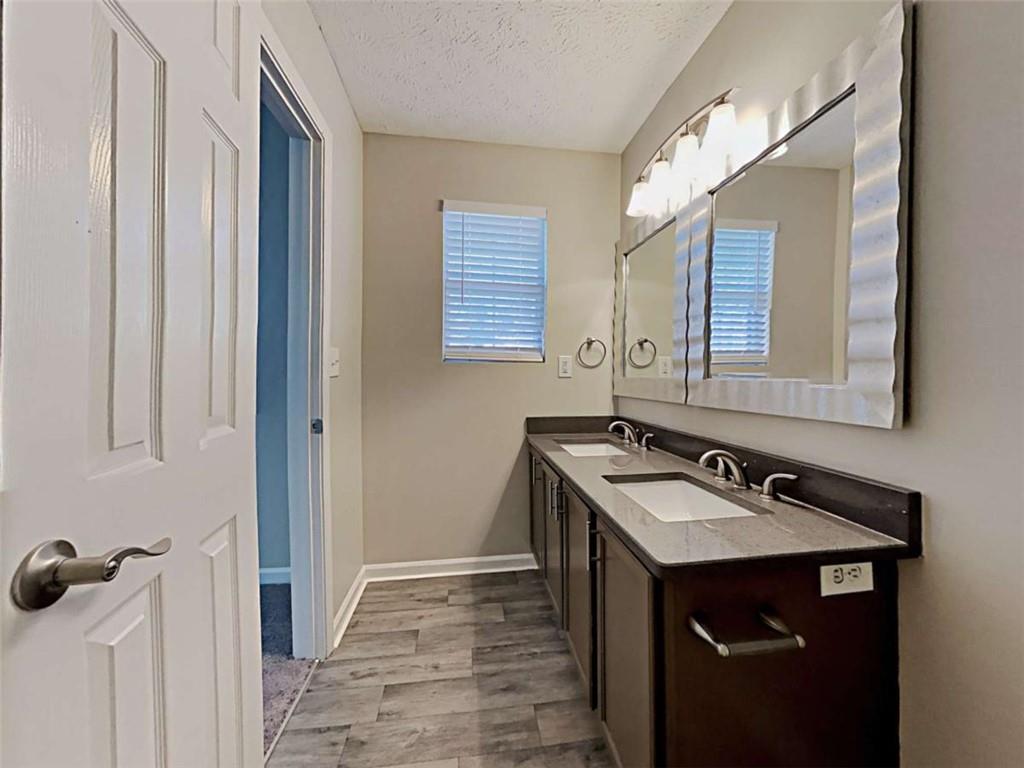 4856 Haymarket Trail Decatur, GA 30035 - Photo 22 of 23 a bathroom with a sink and a mirror
