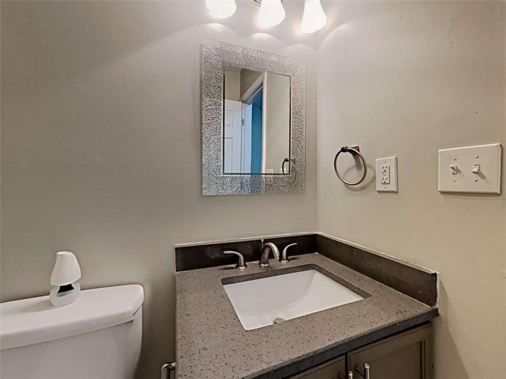 4856 Haymarket Trail Decatur, GA 30035 - Photo 23 of 23 a bathroom with a sink and a mirror