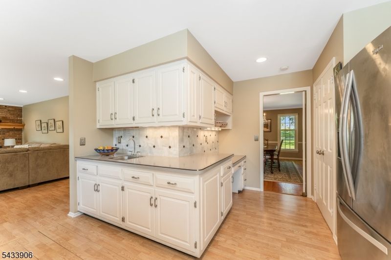 14 Lexington Road Annandale, NJ 08801 - Photo 12 of 47 a kitchen with stainless steel appliances sink a stove and cabinets