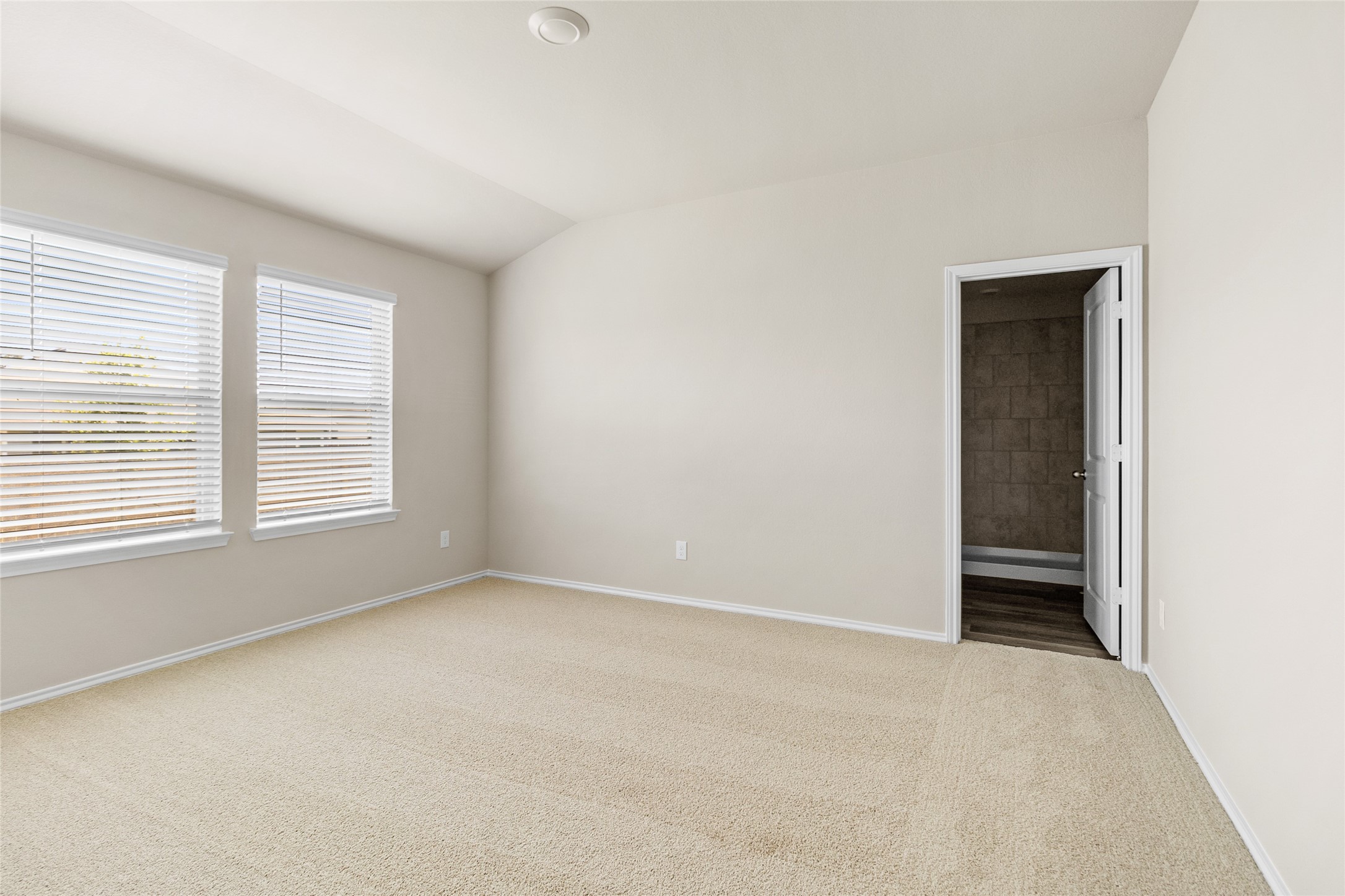 206 Rockbridge Drive Huntsville, TX 77340 - Photo 5 of 15 an empty room with windows and closet