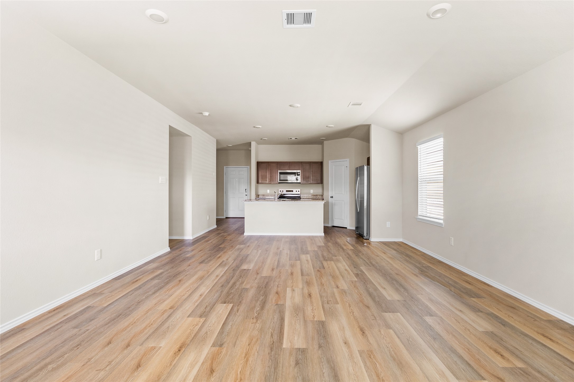 206 Rockbridge Drive Huntsville, TX 77340 - Photo 9 of 15 a view of a livingroom with wooden floor