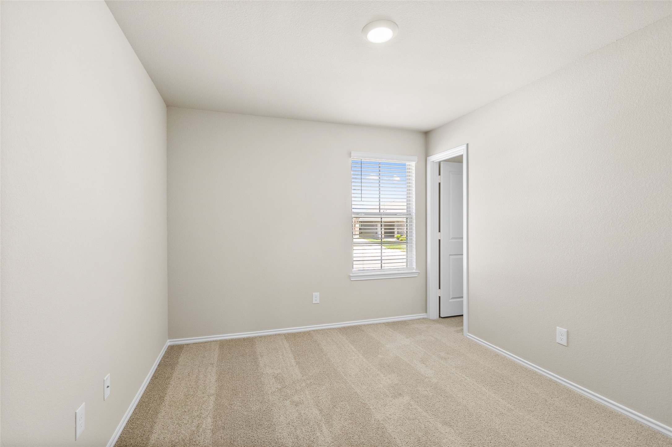 206 Rockbridge Drive Huntsville, TX 77340 - Photo 10 of 15 an empty room with windows