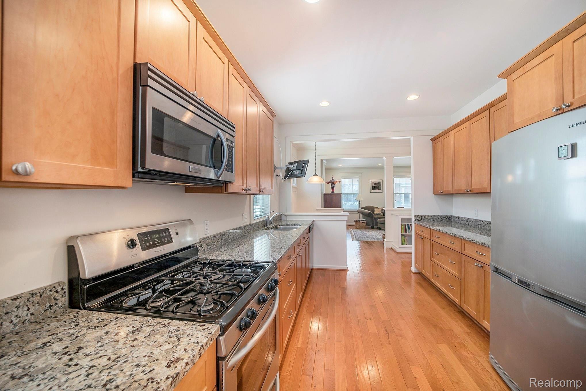 937 Ruffner Avenue Birmingham, MI 48009 - Photo 9 of 39 State-of-the-art kitchen with stainless steel appliances, granite countertops, pull out drawers, and recessed lighting.