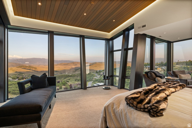 8544 North Promontory Ranch Road Park City, UT 84098 - Photo 16 of 36 Carpeted bedroom with expansive windows, a mountain view, recessed lighting, and wooden ceiling
