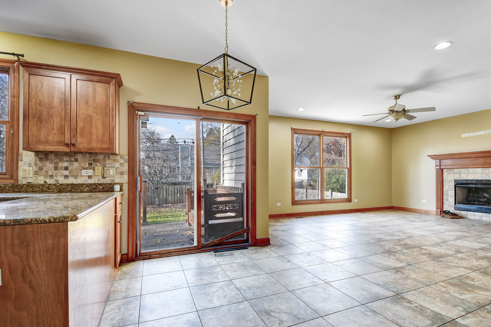 1S174 Addison Avenue Lombard, IL 60148 - Photo 13 of 37 a view of an empty room with a fireplace and a window