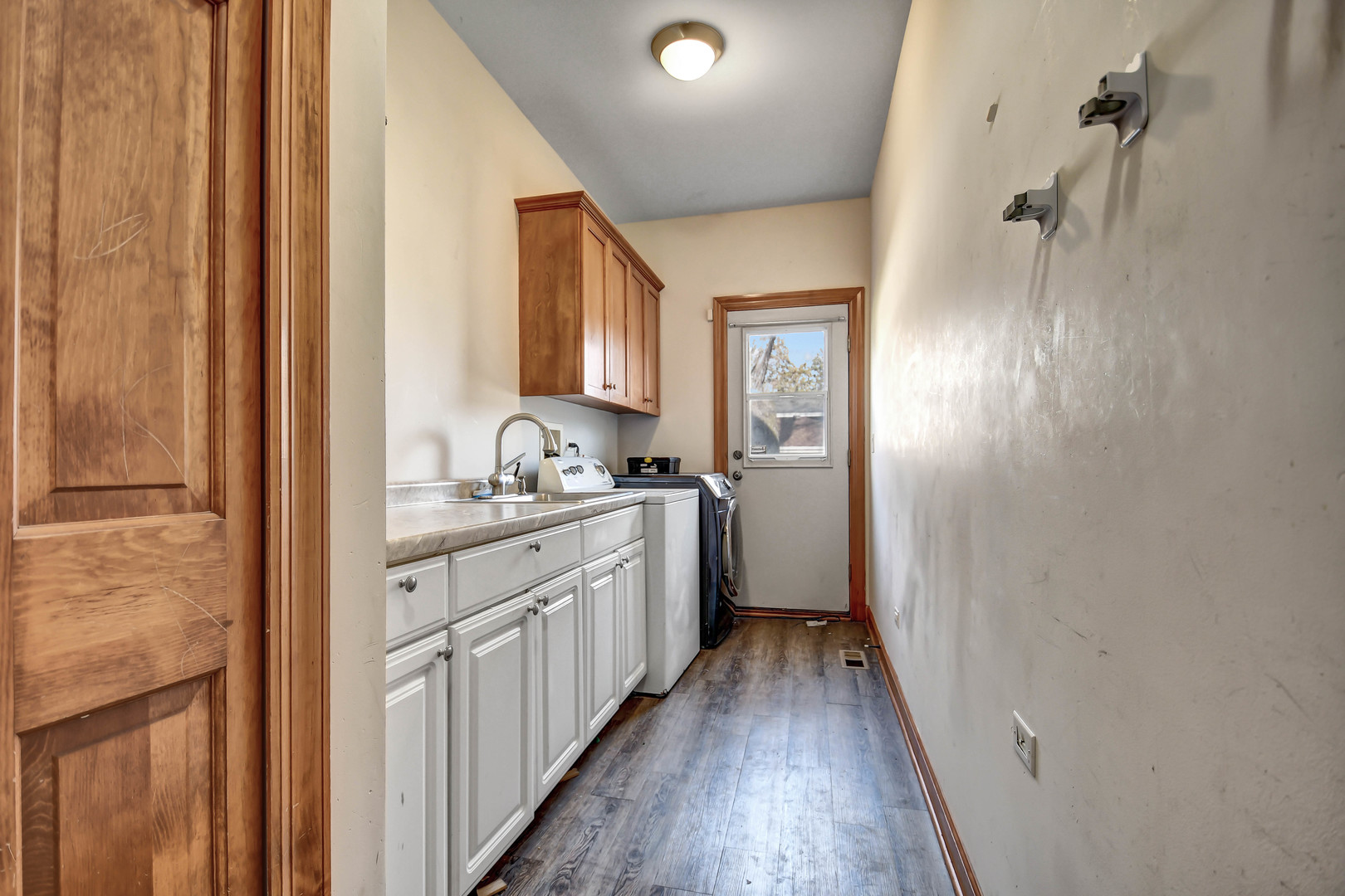 1S174 Addison Avenue Lombard, IL 60148 - Photo 16 of 37 a bathroom with granite countertop a sink and a mirror