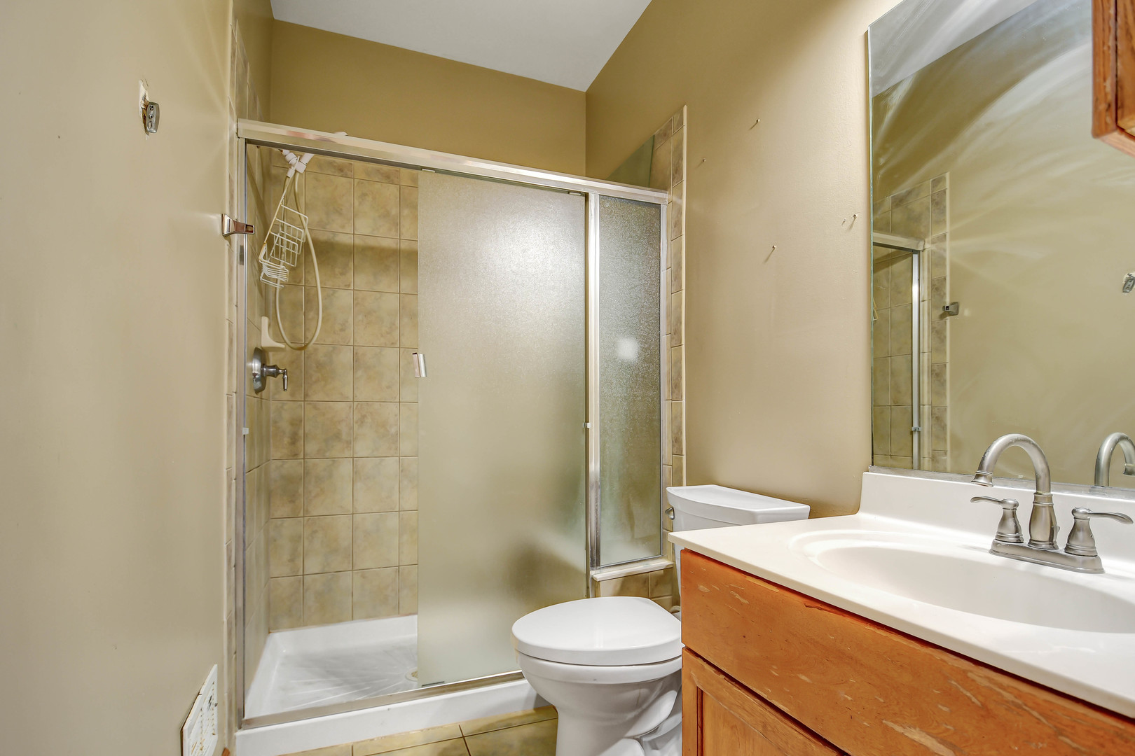 1S174 Addison Avenue Lombard, IL 60148 - Photo 17 of 37 a bathroom with a sink toilet and shower