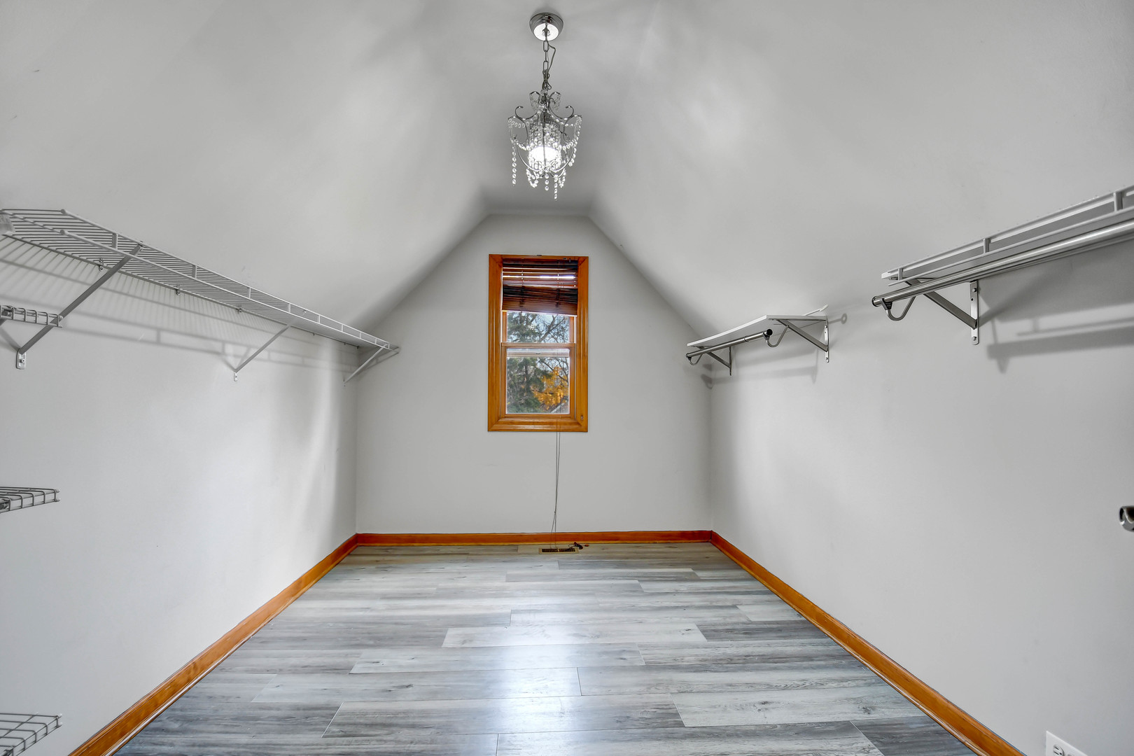 1S174 Addison Avenue Lombard, IL 60148 - Photo 22 of 37 a view of a hallway with wooden floor and a window