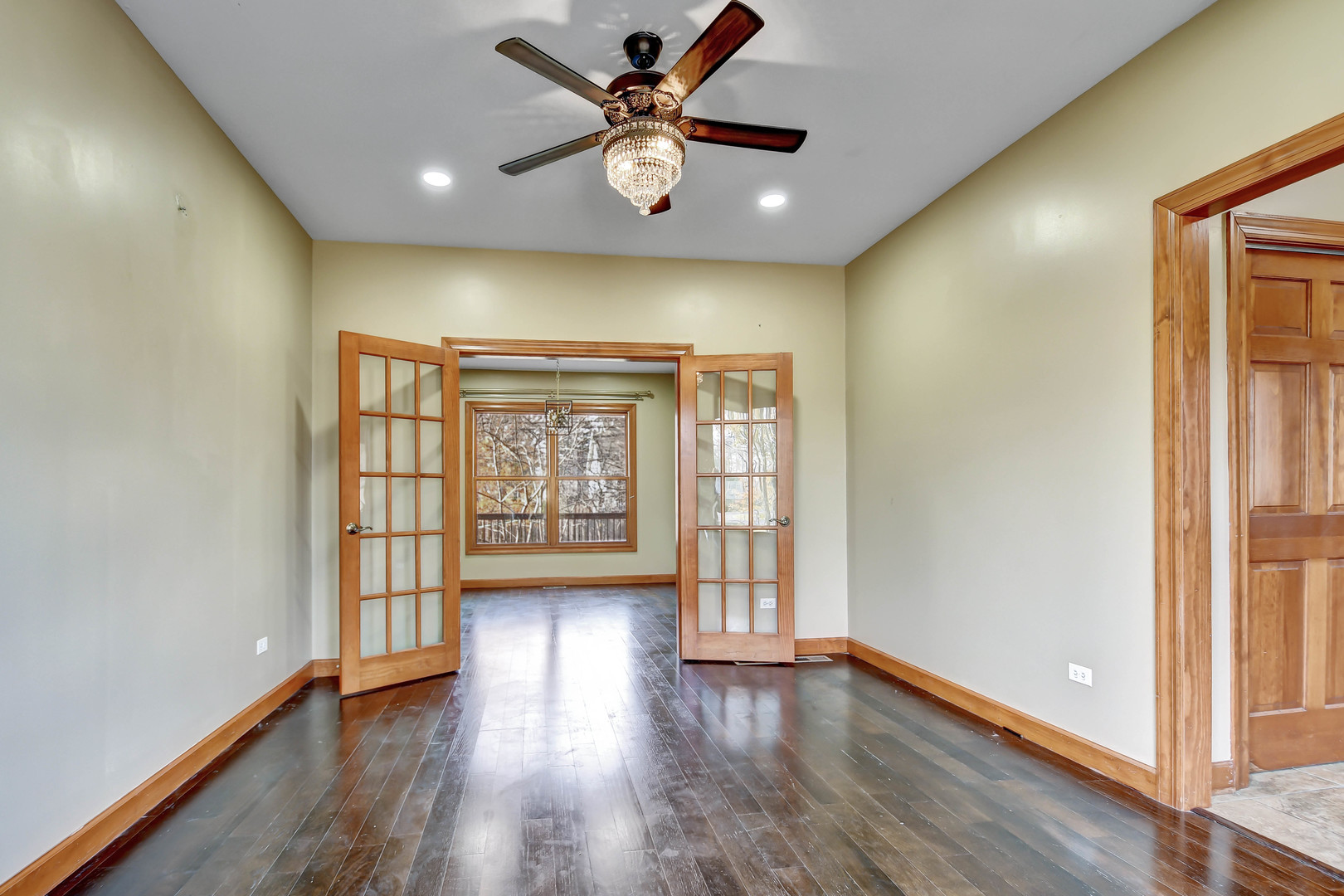 1S174 Addison Avenue Lombard, IL 60148 - Photo 4 of 37 a view of an empty room with a window and wooden floor