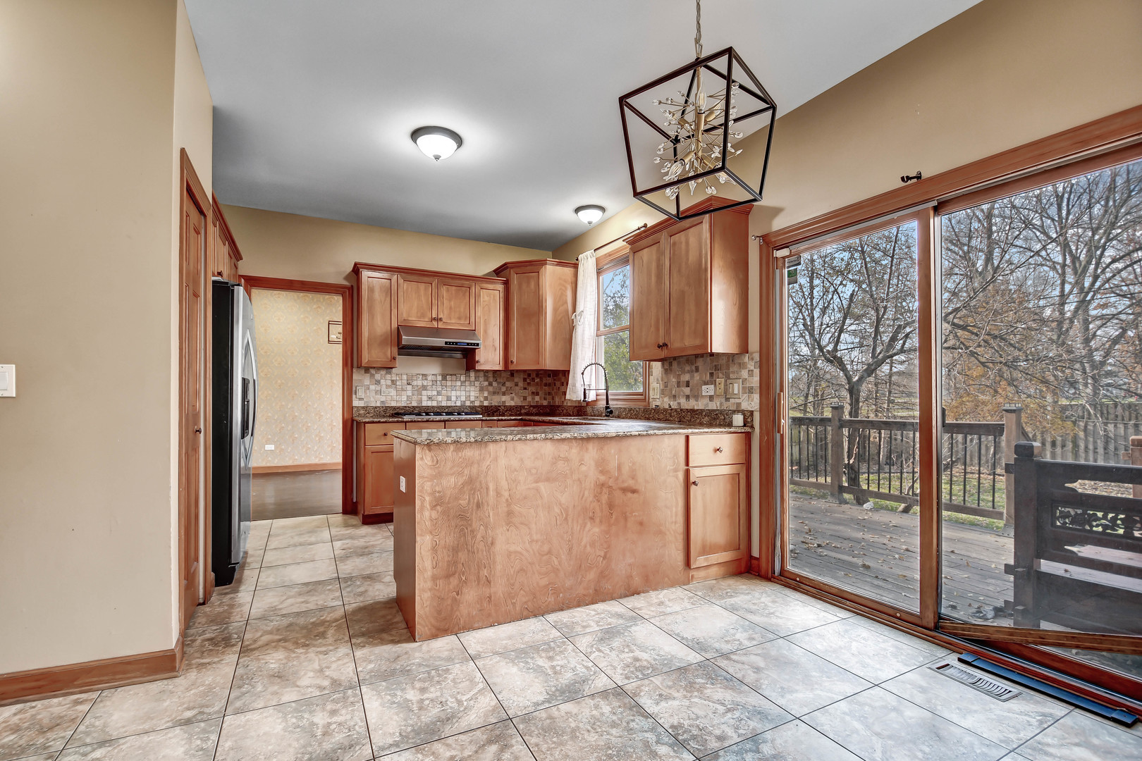 1S174 Addison Avenue Lombard, IL 60148 - Photo 8 of 37 a kitchen with stainless steel appliances granite countertop a refrigerator and a sink