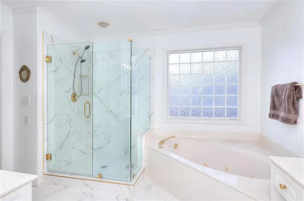 a bathroom with a bathtub and shower