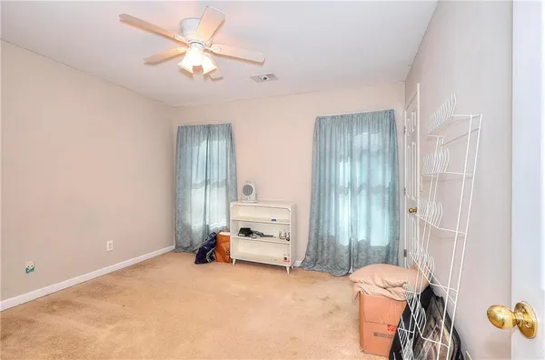 wooden floor and a chandelier fan in a room