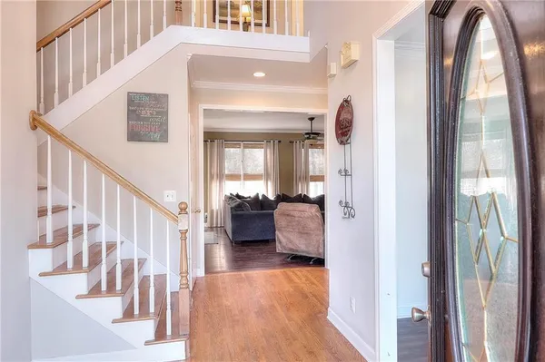 a view of a hallway with a livingroom with furniture