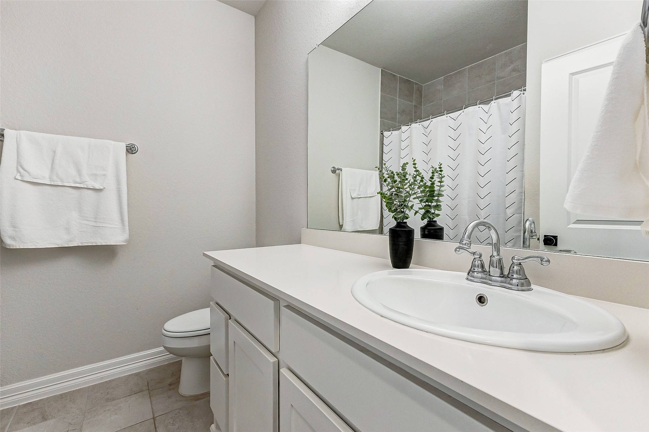 5318 Streamside Trail Fulshear, TX 77441 - Photo 28 of 43 The secondary bathroom features a sink set atop ample cabinets and drawers, providing convenient storage for toiletries and linens.