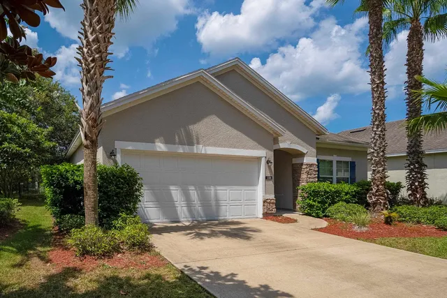 an aerial view of residential houses with outdoor space and street view