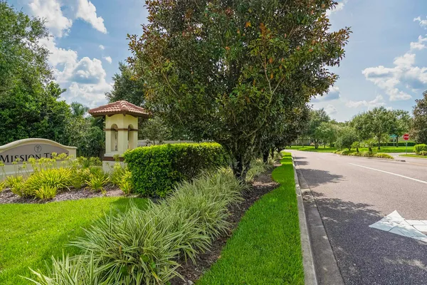 a house that has a tree in front of it
