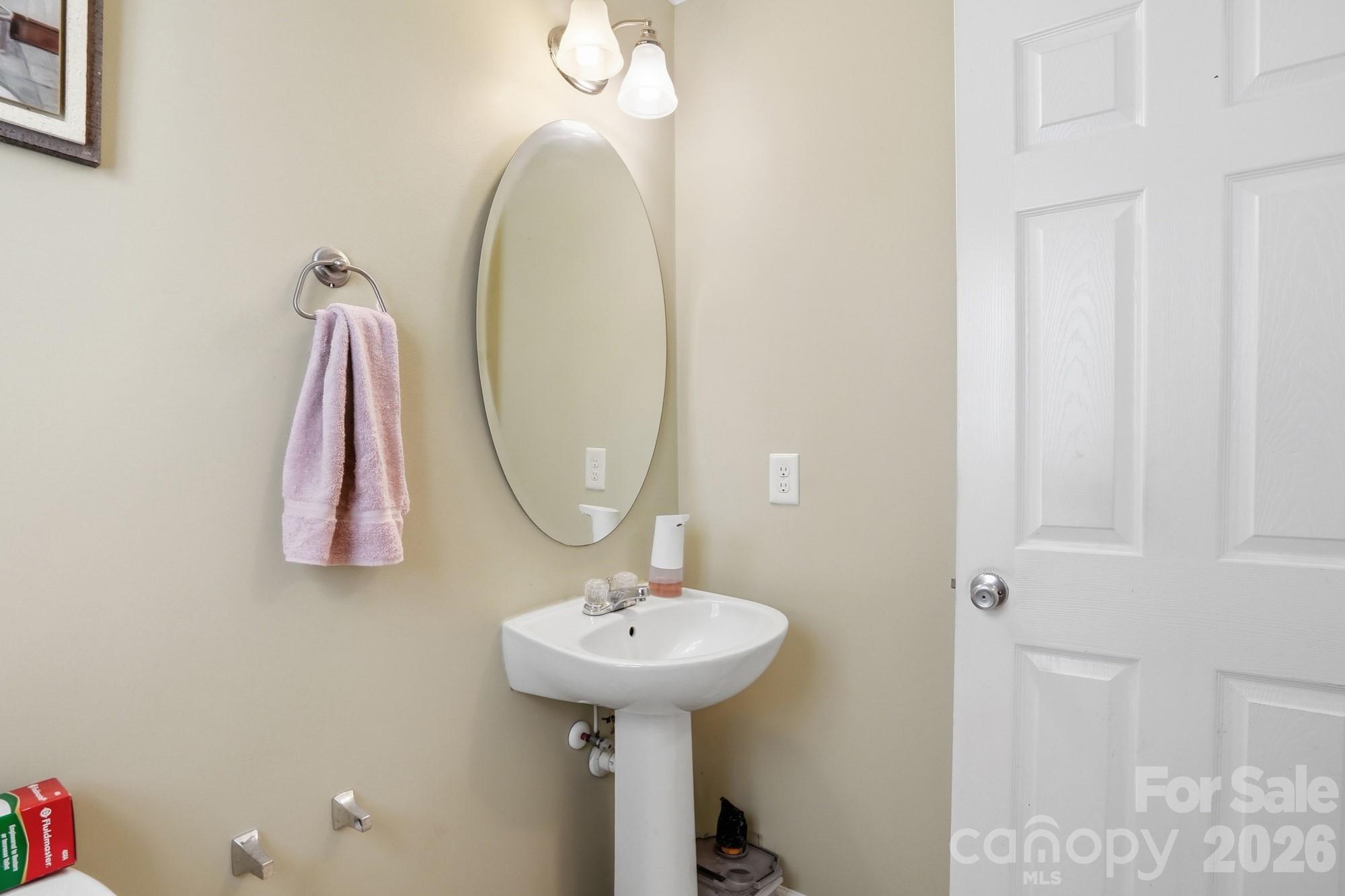 4404 Kiddle Lane Monroe, NC 28110 - Photo 22 of 48 a bathroom with a sink and a mirror