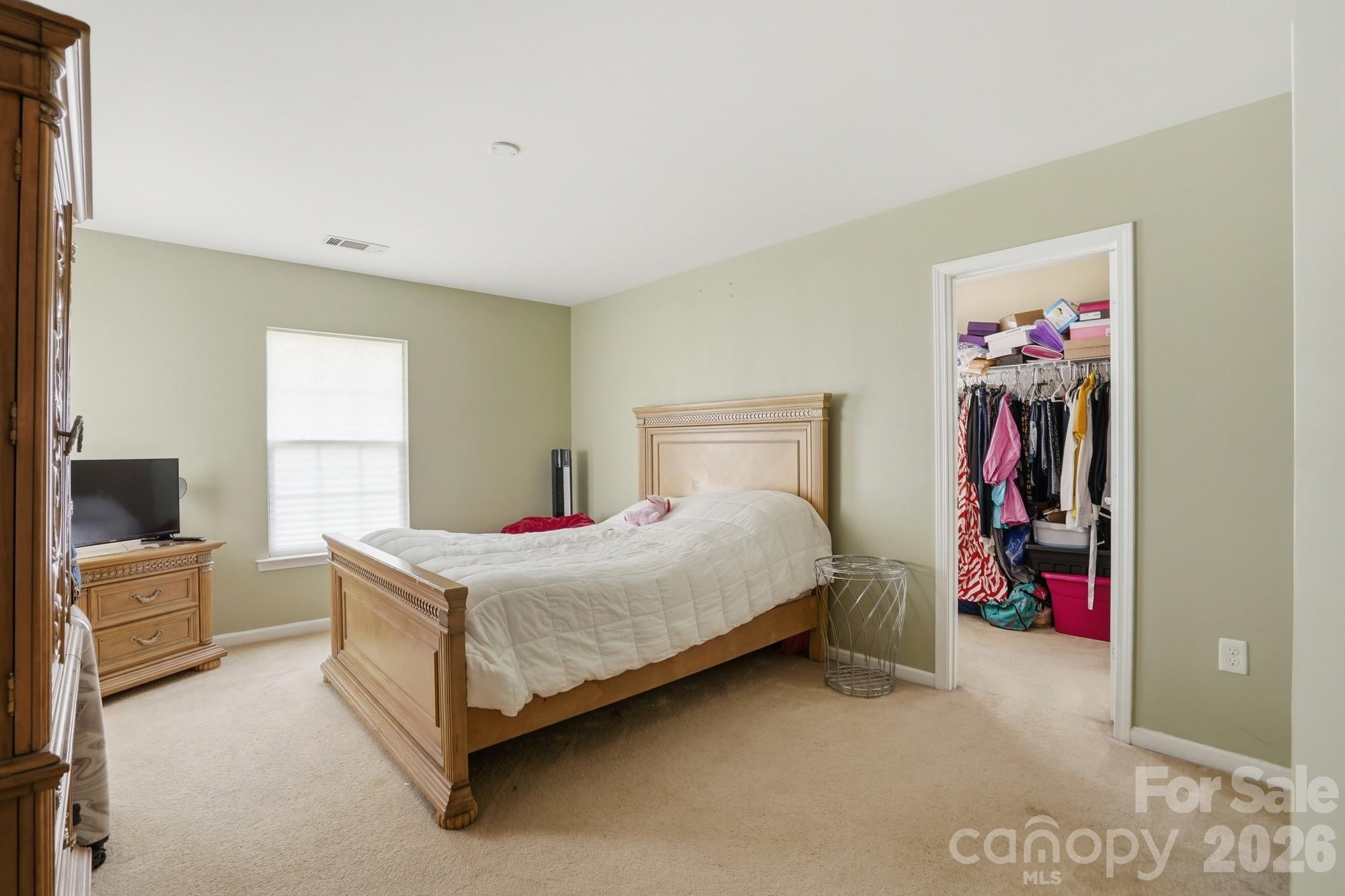 4404 Kiddle Lane Monroe, NC 28110 - Photo 26 of 48 a bedroom with a bed and a view of bathroom