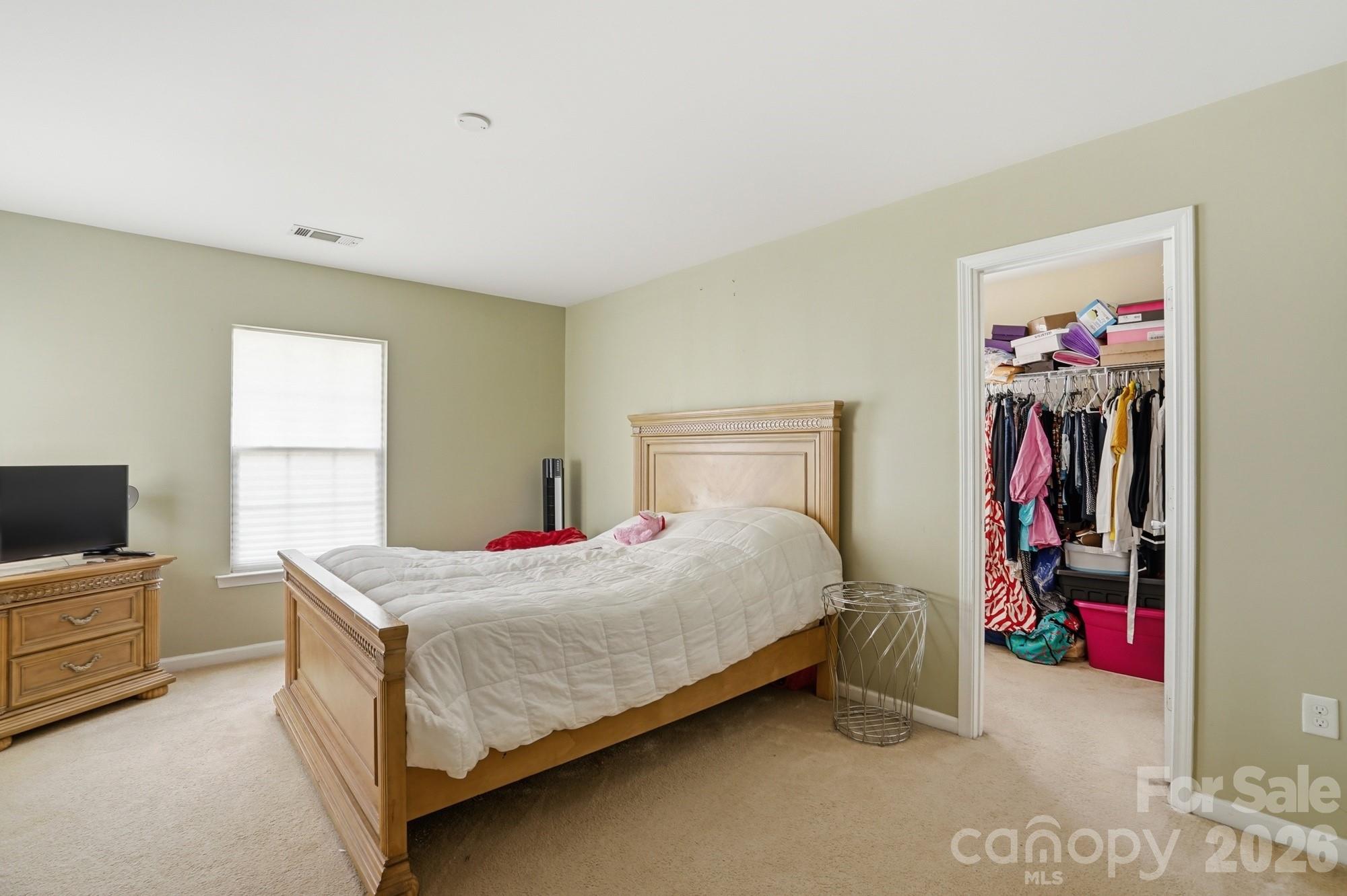 4404 Kiddle Lane Monroe, NC 28110 - Photo 27 of 48 a bedroom with a bed and a flat screen tv