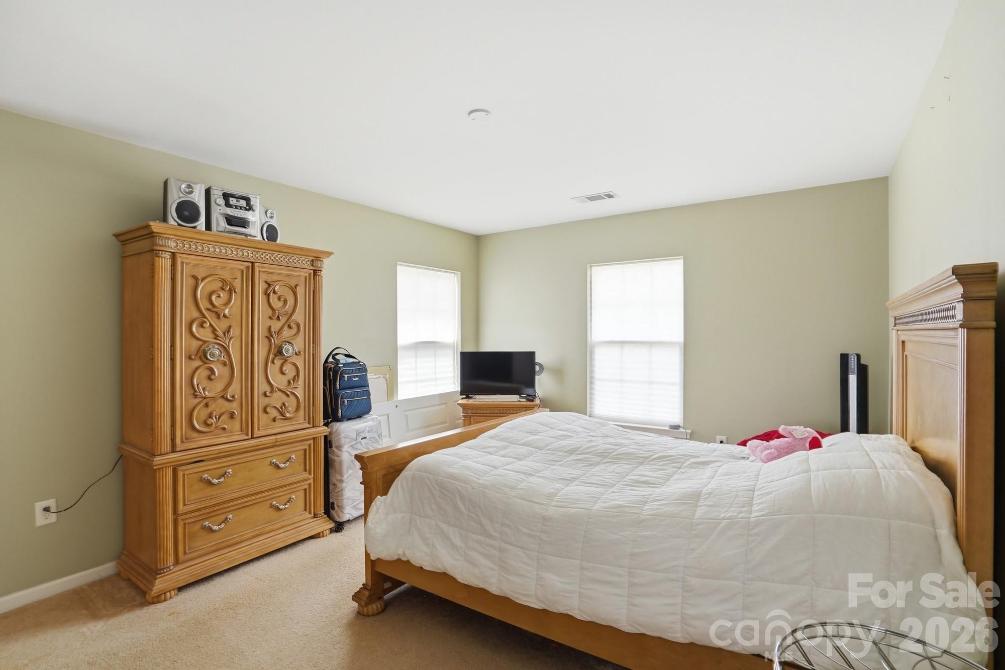 4404 Kiddle Lane Monroe, NC 28110 - Photo 28 of 48 a bedroom with a bed and a window