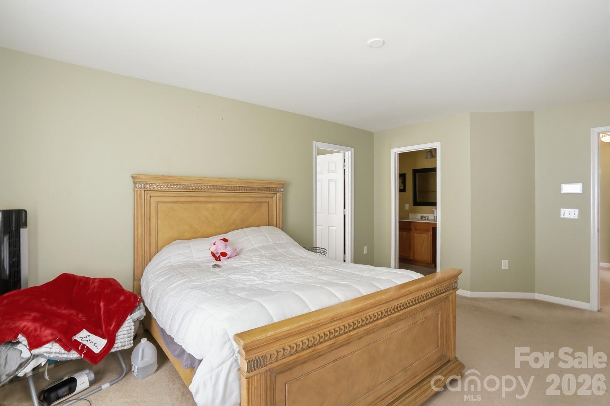 4404 Kiddle Lane Monroe, NC 28110 - Photo 29 of 48 a bedroom with a bed and a couch