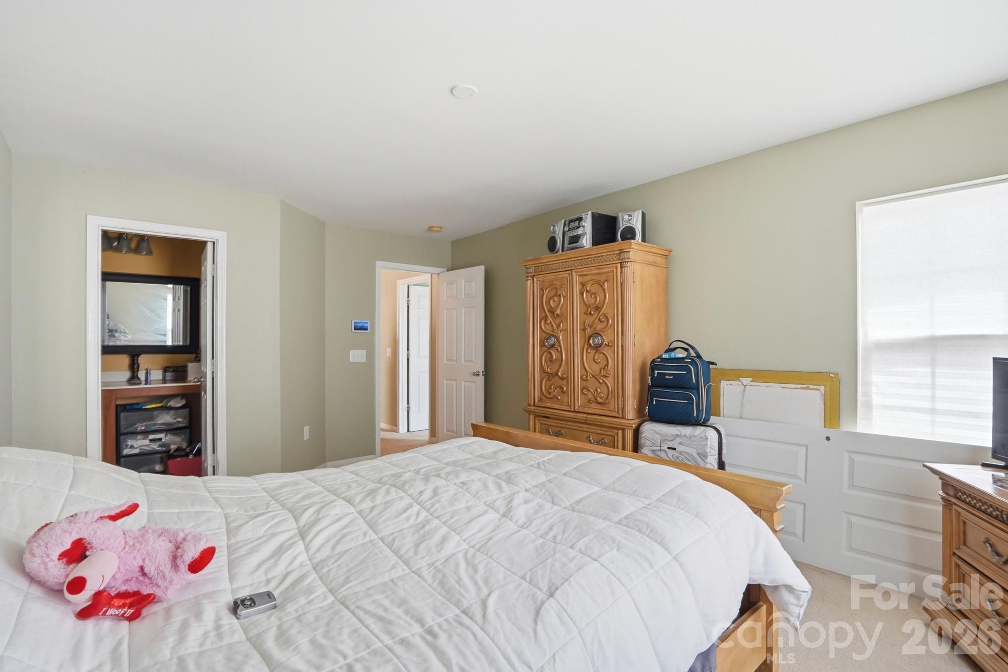 4404 Kiddle Lane Monroe, NC 28110 - Photo 30 of 48 a bedroom with a bed and a dresser