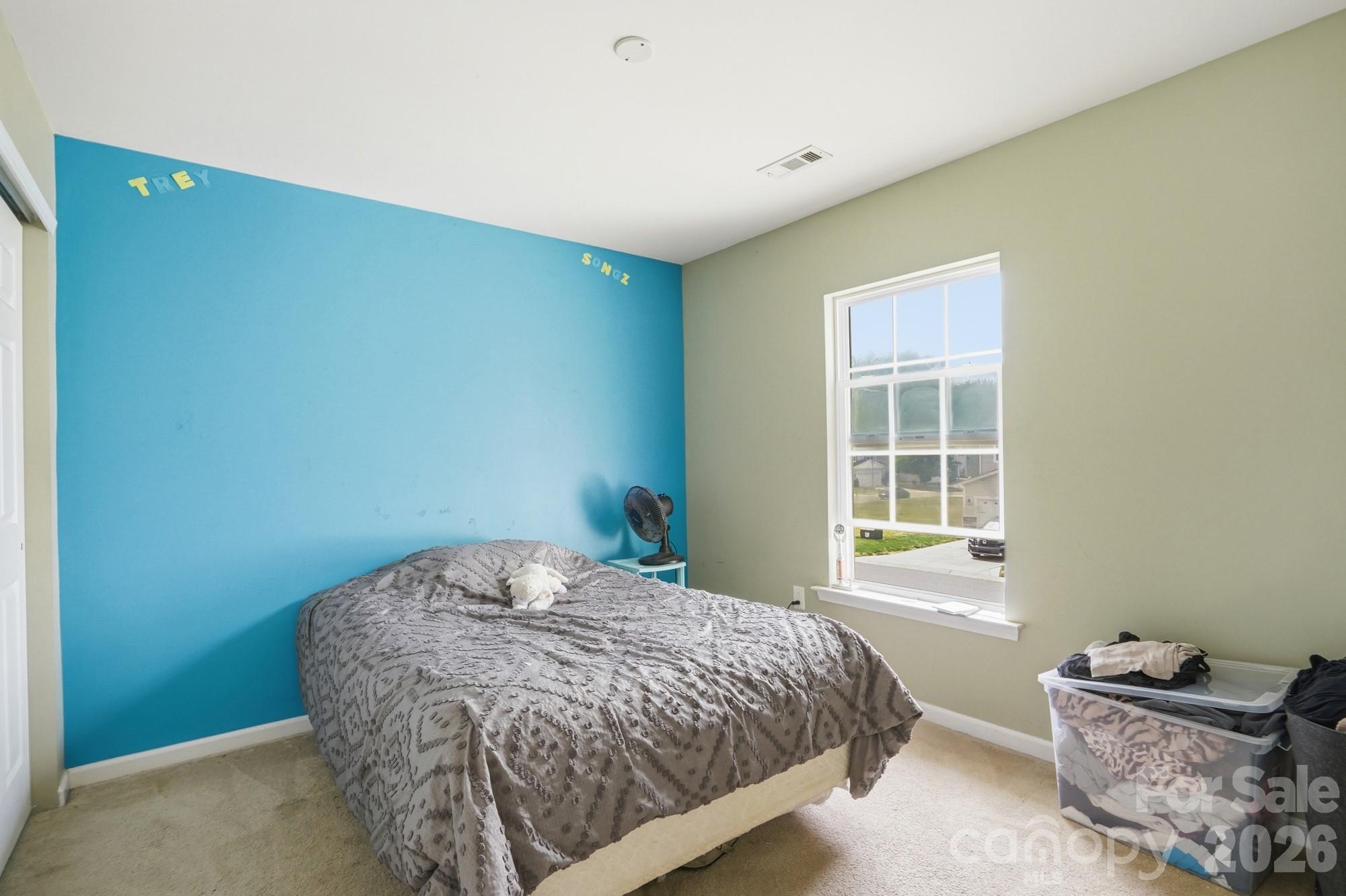 4404 Kiddle Lane Monroe, NC 28110 - Photo 34 of 48 a bedroom with a bed and windows
