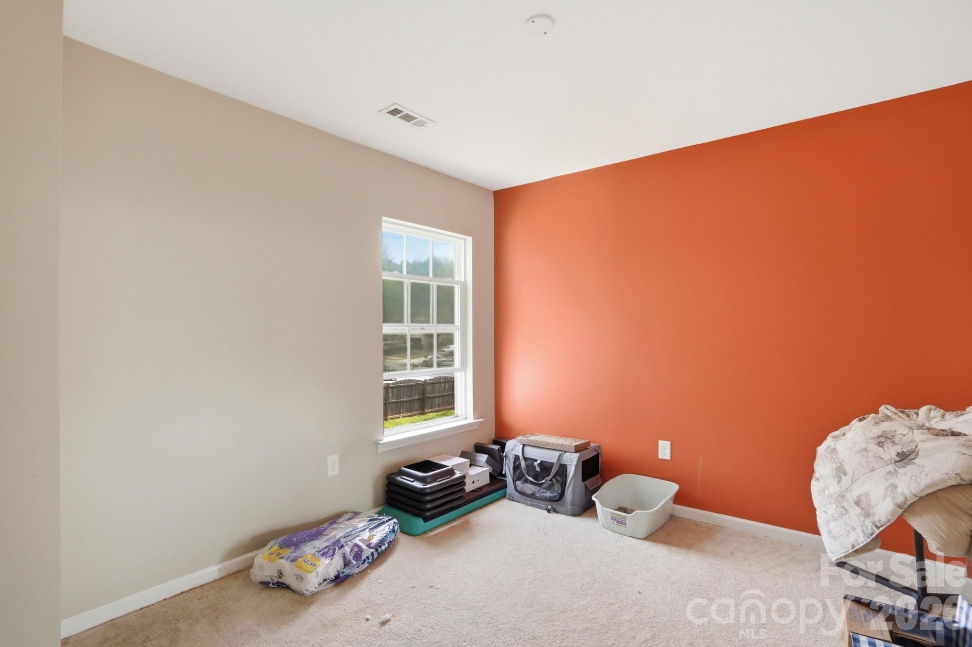 4404 Kiddle Lane Monroe, NC 28110 - Photo 40 of 48 a bedroom with furniture and a window