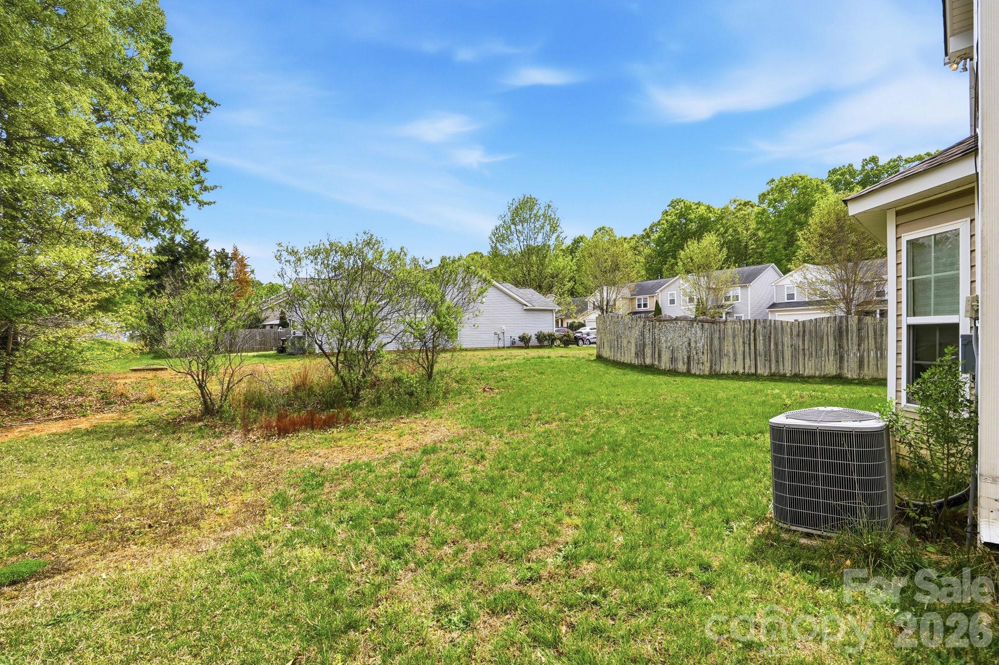 4404 Kiddle Lane Monroe, NC 28110 - Photo 47 of 48 a view of a house with a yard and sitting area