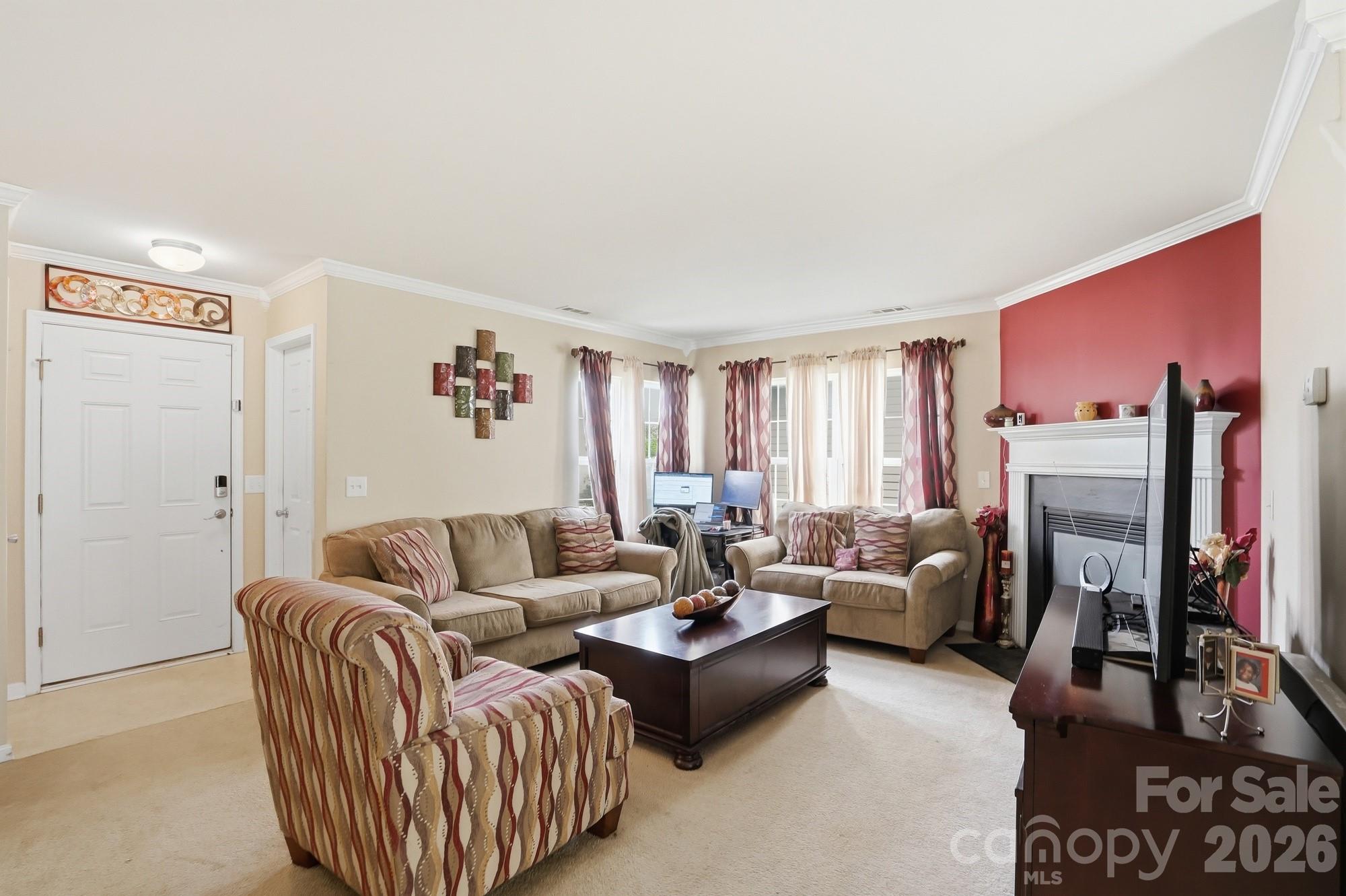 4404 Kiddle Lane Monroe, NC 28110 - Photo 9 of 48 a living room with furniture and a flat screen tv