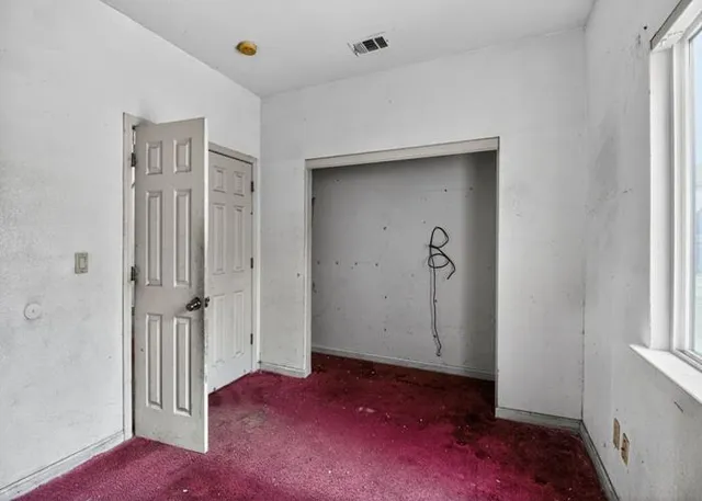 an empty room with windows