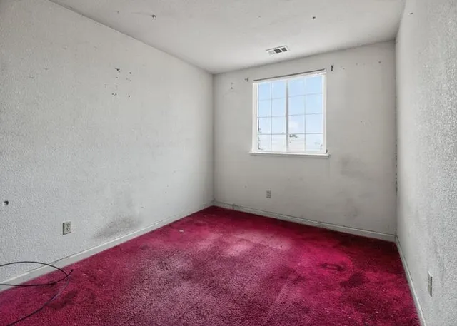 an empty room with a window
