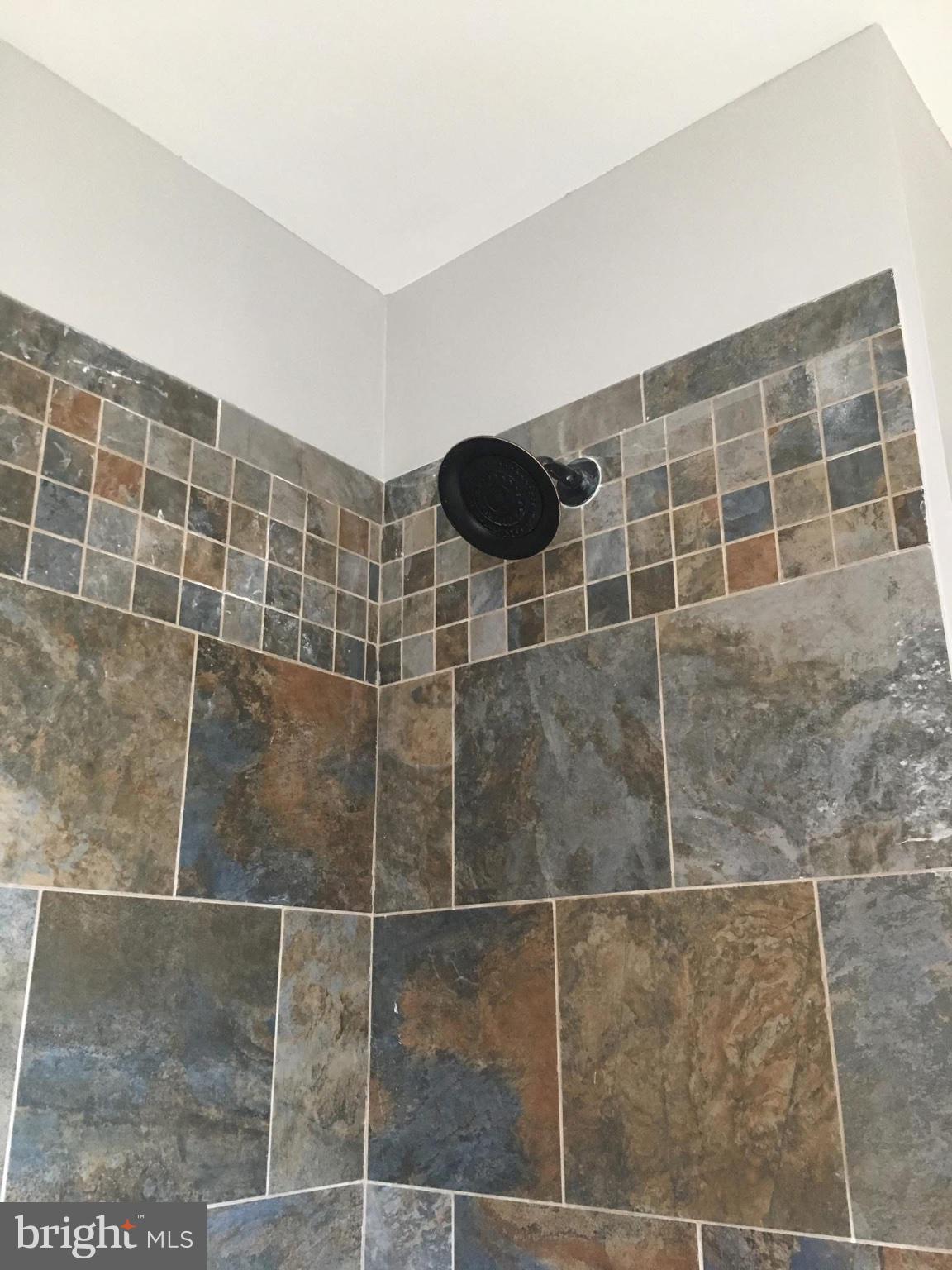 710 Mace Avenue Baltimore, MD 21221 - Photo 3 of 6 Elegant tiled shower corner design.